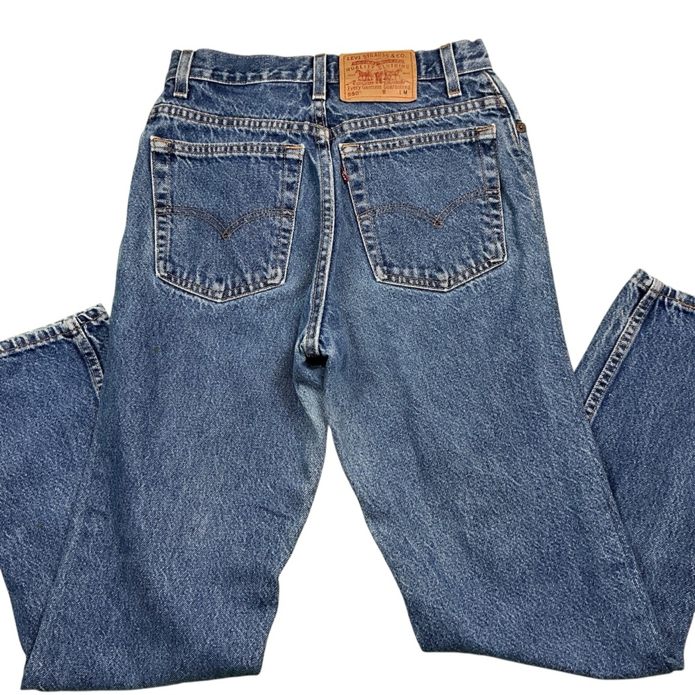 Vintage Levi’s 550 medium wash 90s jeans USA made tapered leg 26 x 29